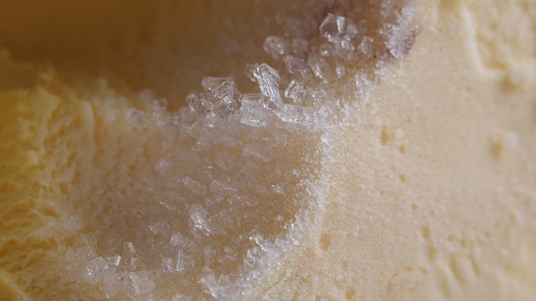 Top view of a peach-colored ice cream with ice crystals on it