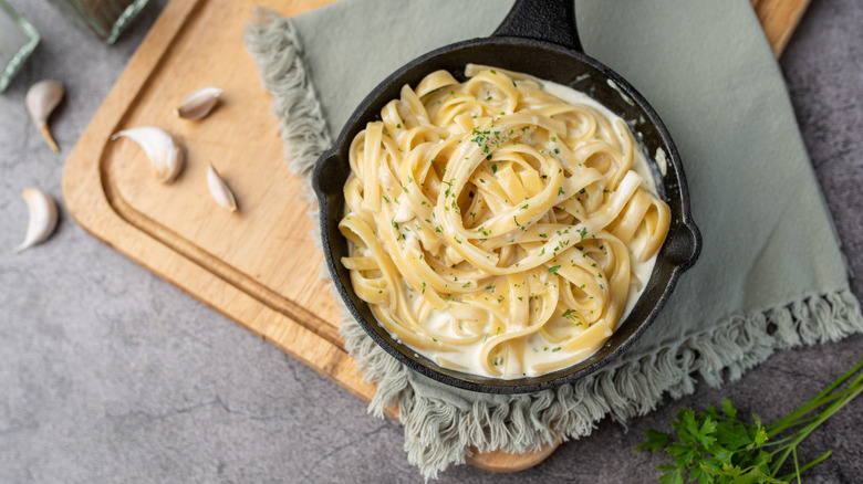 Skillet with pasta and cream sauce