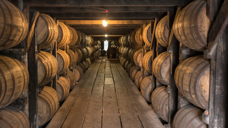 barrels in whiskey aging room