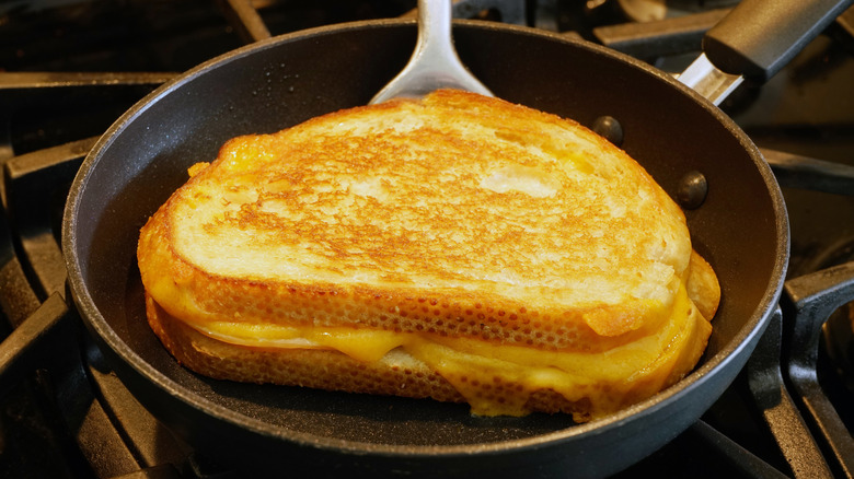 grilled cheese cooking in pan