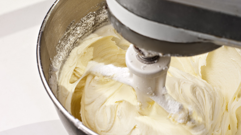 Stand mixer mixing cream cheese frosting
