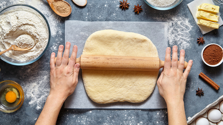 Person rolling out dough