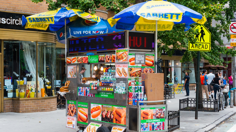 New York pushcart  with Sabrett umbrellas selling hot dogs