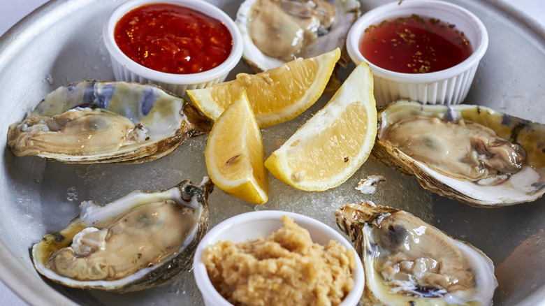 Oysters on the half shell with various sauces