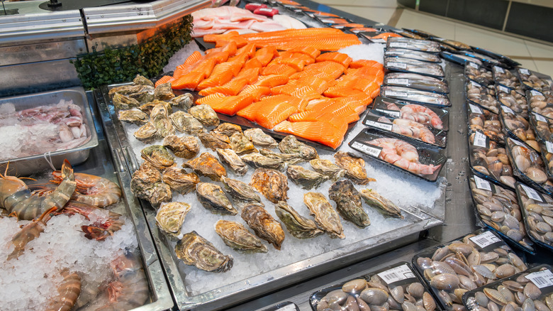 A seafood counter with large variety of shellfish