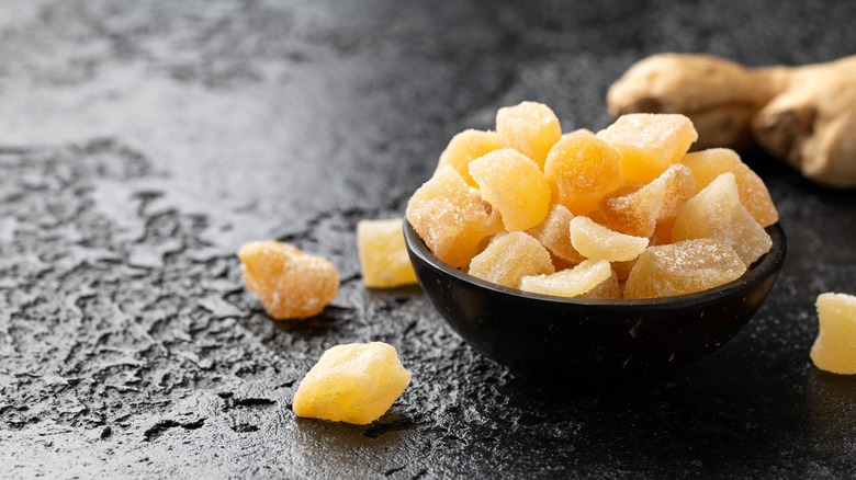 candied ginger in black bowl