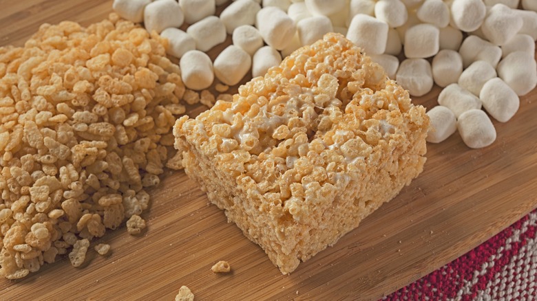 Rice Krispie Treat next to cereal and marshmallows