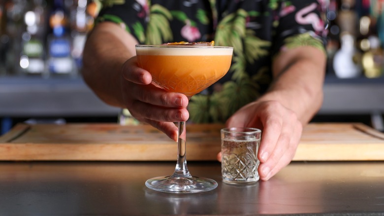 Bartender serving pornstar martini