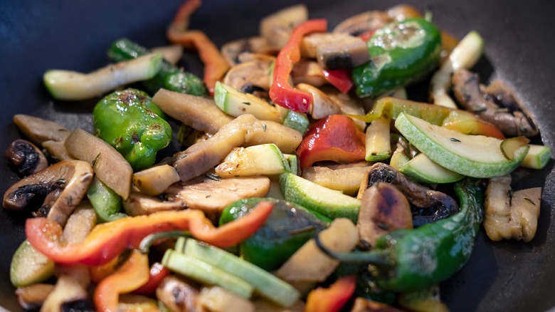 colorful sauteed vegetables in a pan