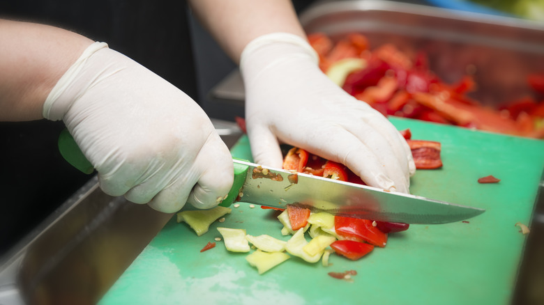 Chopping veggies on cutting board