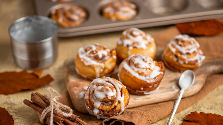 cinnamon buns on wooden board