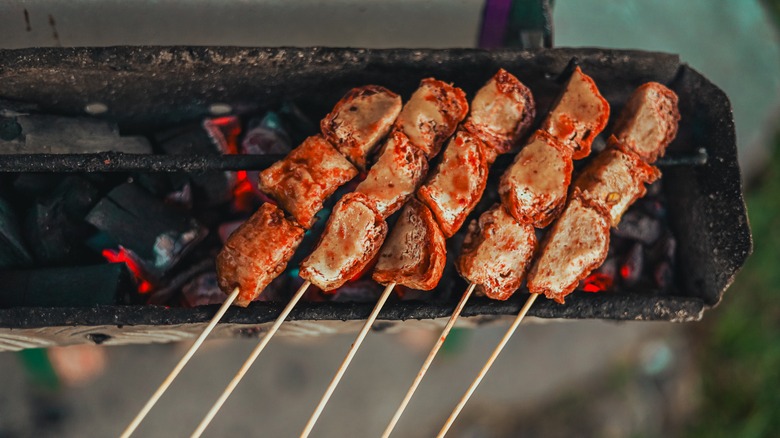 grilled tofu skewers on traditional Indonesian grill