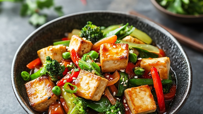 tofu and vegetable stir fry in gray bowl