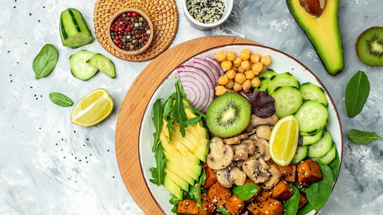 vegan tofu poke bowl with variety of produce