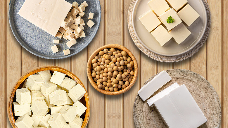 different kinds of tofu on wooden background