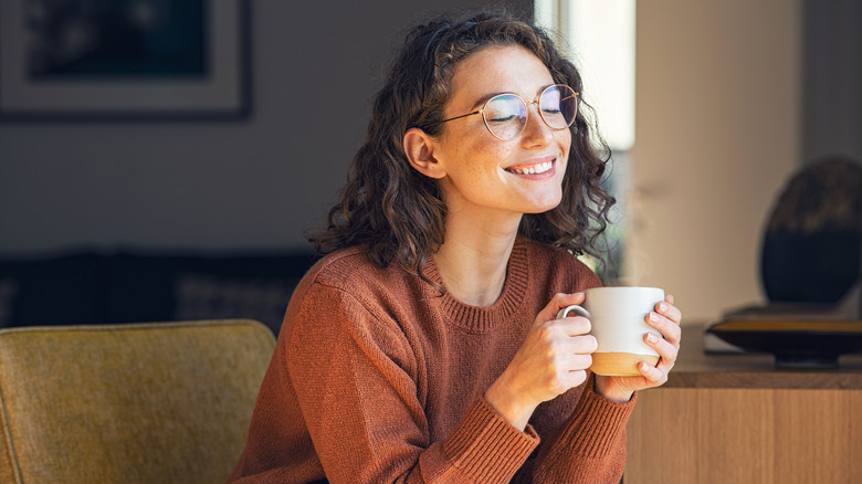 happy woman drinking healthy drink