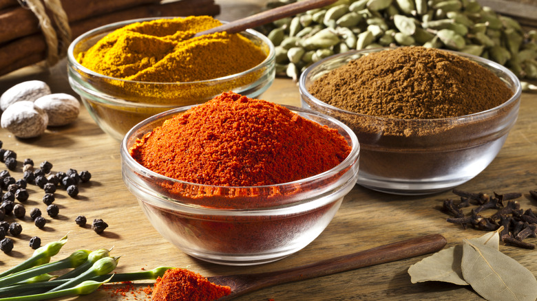 colorful spices in glass bowls