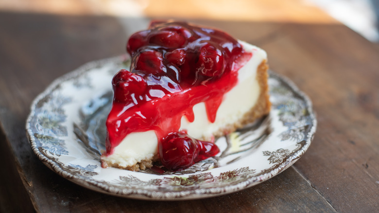 Slice of cheesecake covered in fruit