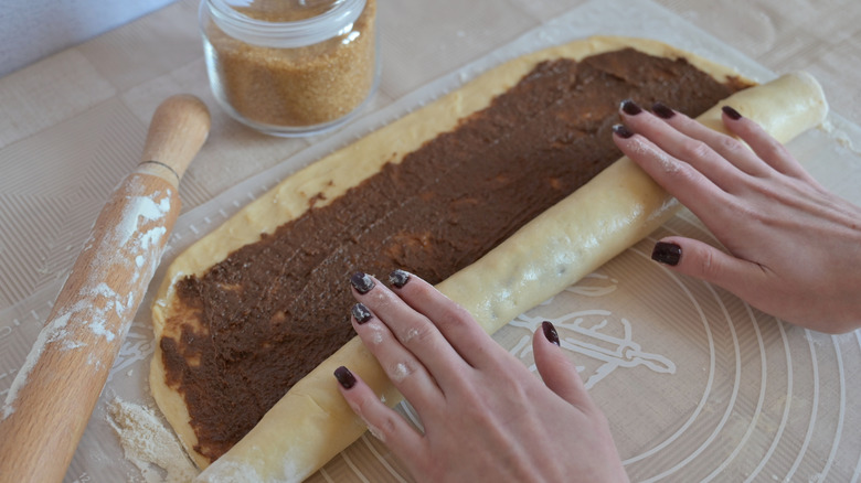 Cinnamon roll dough with cinnamon-butter paste