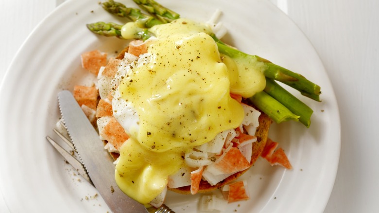 Eggs Benedict with lobster and asparagus