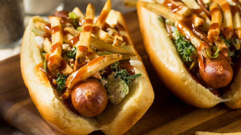 A Polish Boy hot dog is topped with fries and coleslaw.