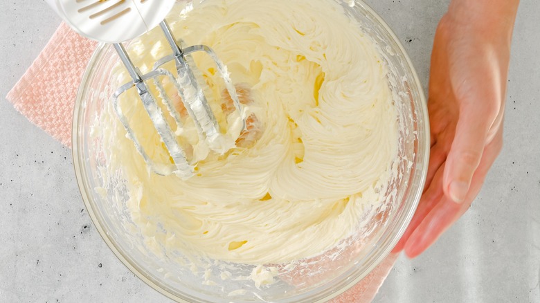 Mixing cheesecake batter in bowl