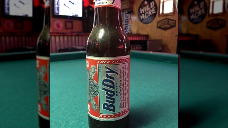 bottle of Bud Dry on pool table