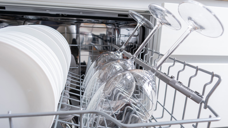 Wine glasses and dishes in a dishwasher