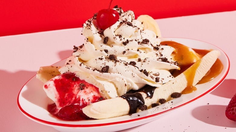 Banana split with whipped cream and a cherry