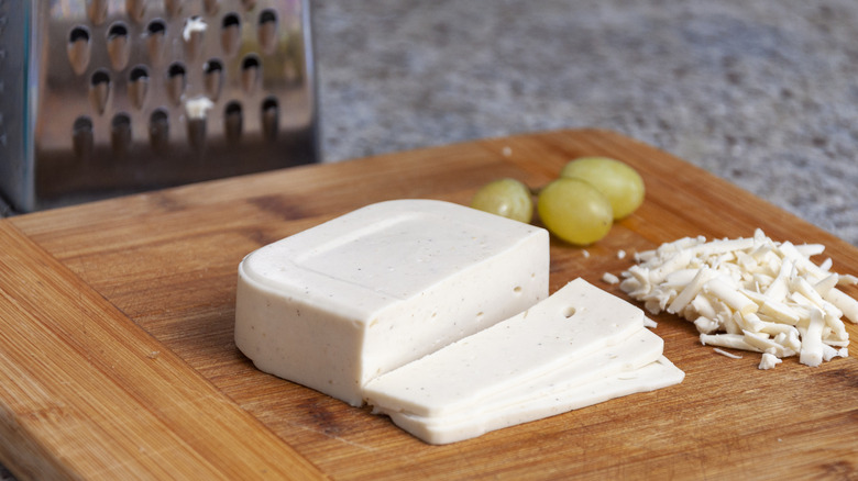 Vegan mozzarella on wooden board