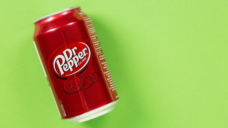 Can of Dr. Pepper on green background