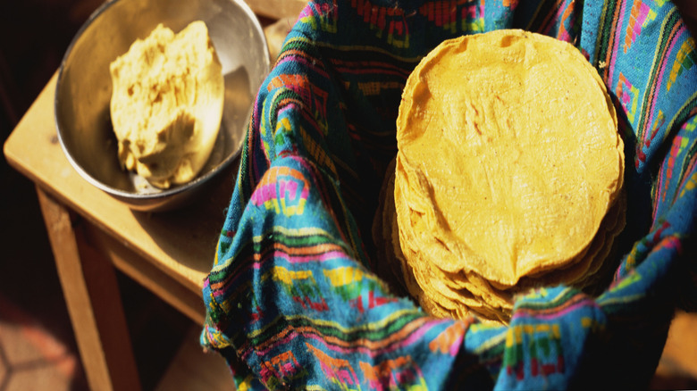 Corn tortillas in a colorful basket