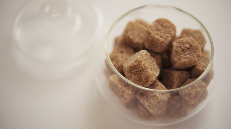 Bowl of brown sugar cubes