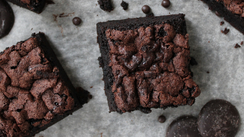 slightly separated brownie squares on paper