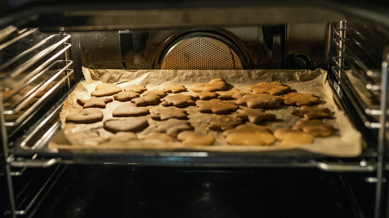 Gingerbread cookies baking in an oven