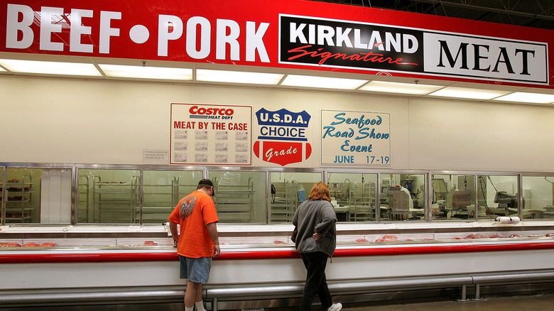 Customers at Costco meat counter