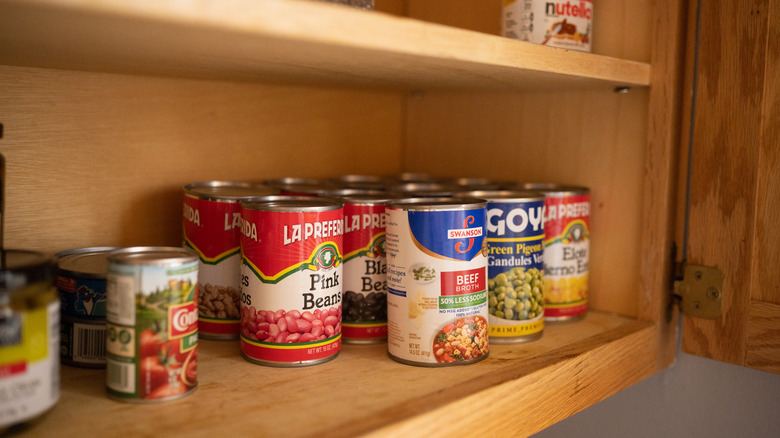 Canned food in a cupboard