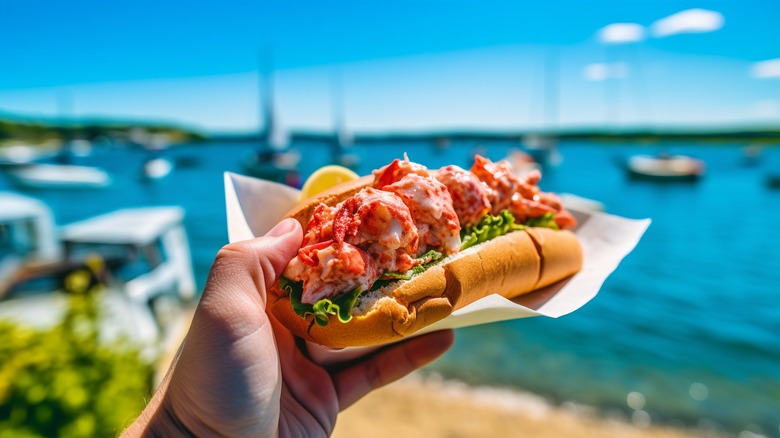 lobster roll held in hand