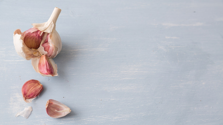 garlic cloves on blue background