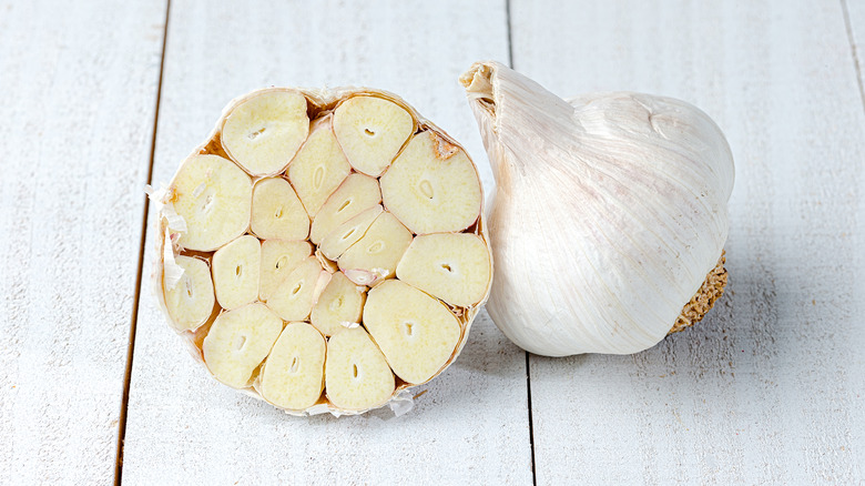 half and whole garlic bulb