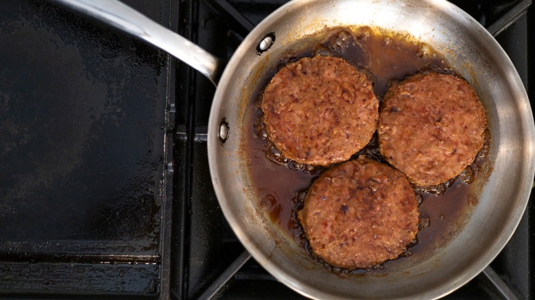 Three veggie burgers in a pan