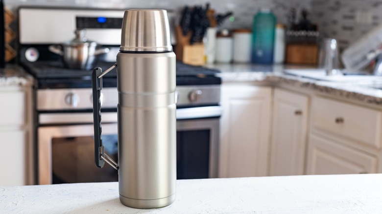 Insulated drink container on kitchen counter