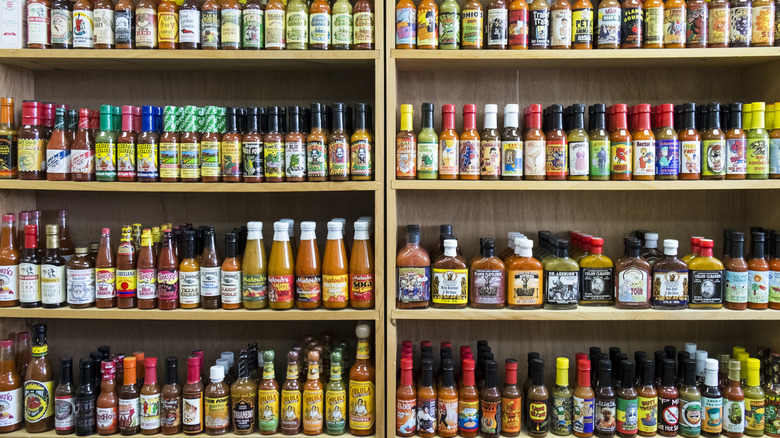 Rows and rows of hot sauce varieties on shelves