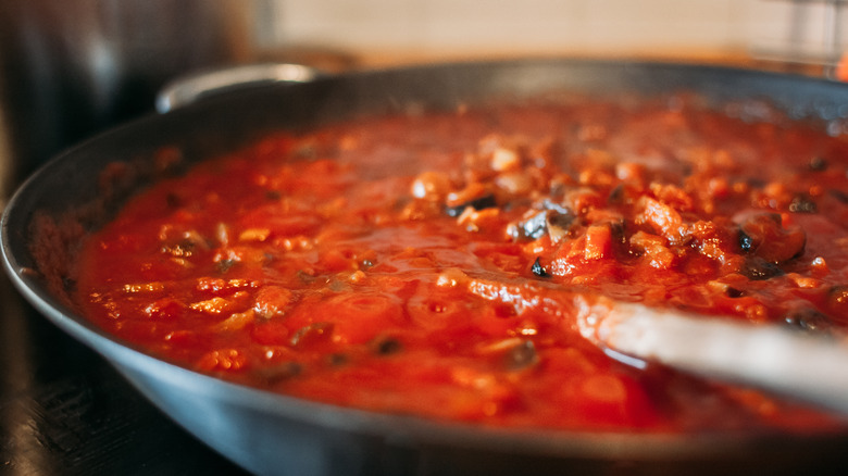 preparing tomato sauce