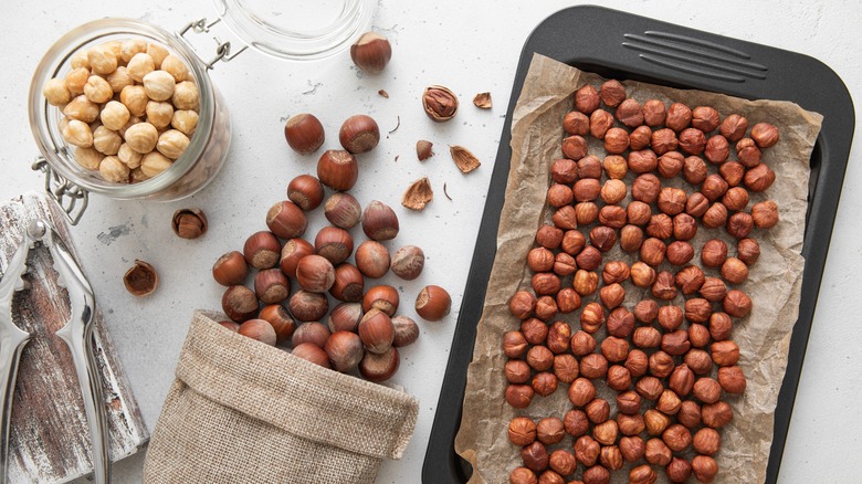 Raw hazelnuts on baking tray