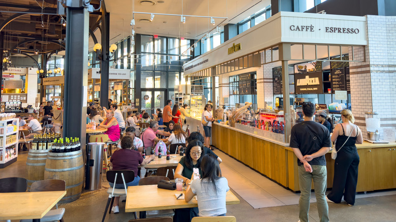 People dining and shopping inside of Eataly