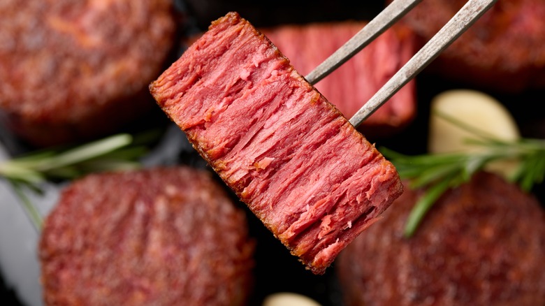 Skewer holding cut of vegan steak