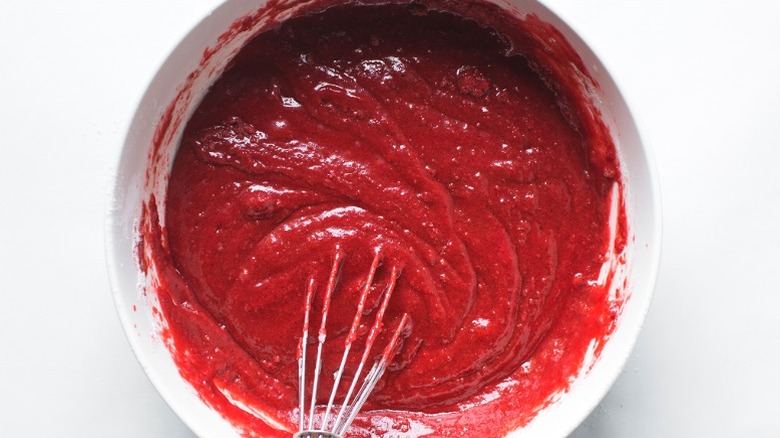 Red-dyed cake mix in bowl