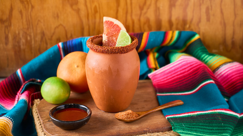 Cantarito with citrus and Tajin on a spoon