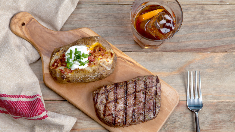 Whiskey with steak and baked potato